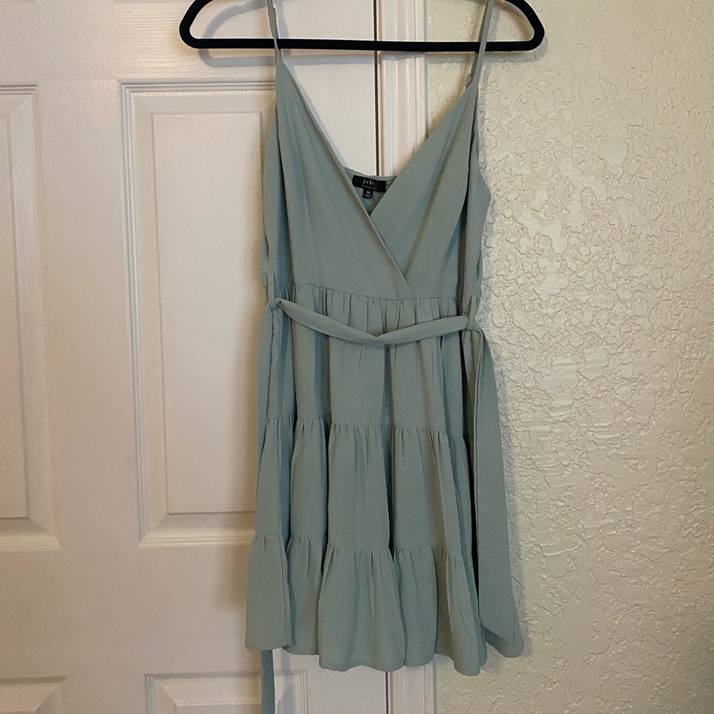 Sea green romper ties in the back